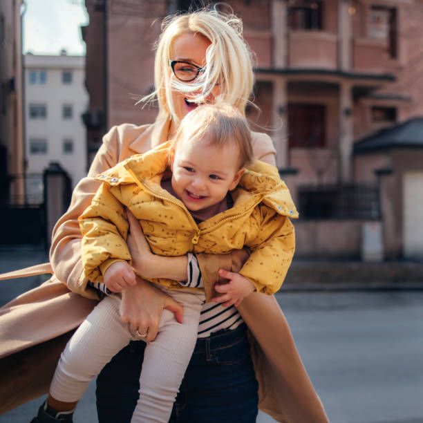 istock Mother Spinning her Daughter in City 1340982489