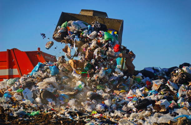 istock Caterpillar compactor working in a landfill 1340985746