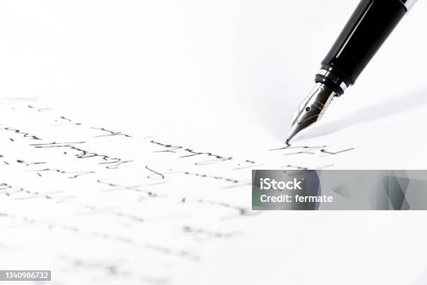 Black Fountain Pen Is Writing A Letter Or A Manuscript On A White Paper Copy Space Closeup Shot With Selected Focus Stock Photo - Download Image Now