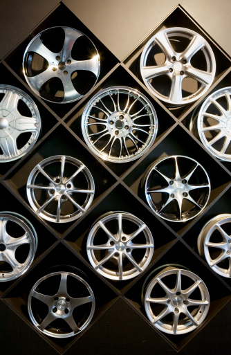 Consumer choice. A wall of alloy wheels at a specialist accessory-dealer's store. Camera: Canon 5D.
