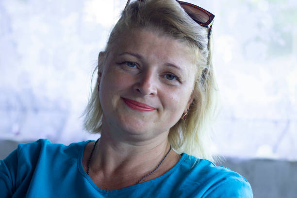 istock A beautiful woman smiles while looking at the camera 1340992619