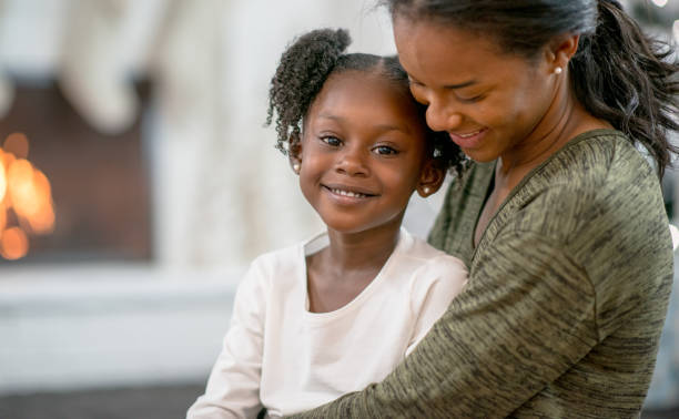 istock Mother and Daughter Hug on Christmas 1340992886