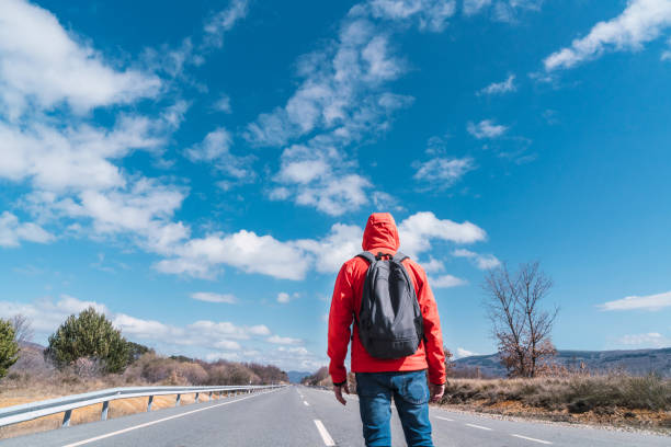 istock unrecognizable person walking on a road 1340994255