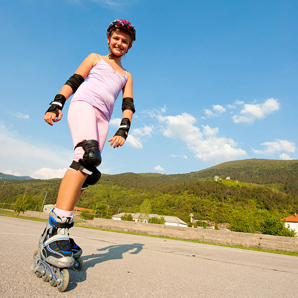 istock Cute young girl rollerskates on a playground 134099544