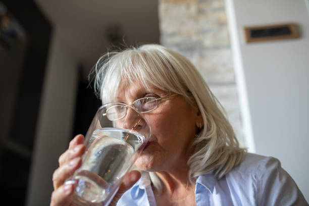 istock Woman With a Glass od Water 1340997098