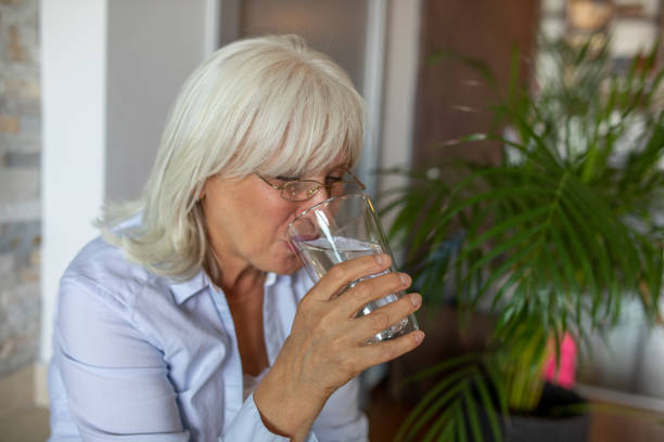 istock Woman With a Glass od Water 1340997104