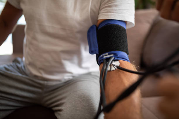 istock Doctor checking patients blood pressure 1341001506