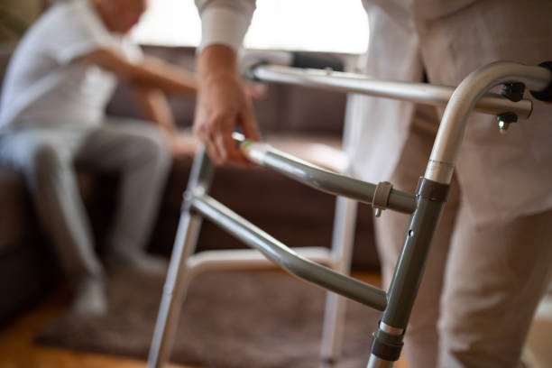 istock Nurse preparing mobility walker for her patient 1341001568