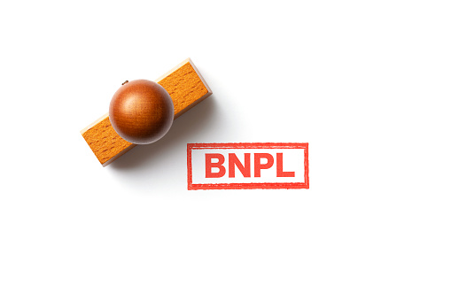 Wooden BNPL stamp on white background