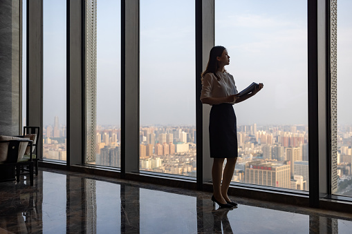 Business women in front of glass windows