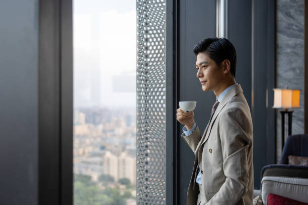 istock Asian business men are drinking coffee 1341007283