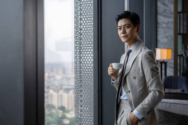 istock Asian business men are drinking coffee 1341007286
