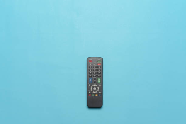 istock Flatlay of Tv remote isolate on cyan background. 1341010850