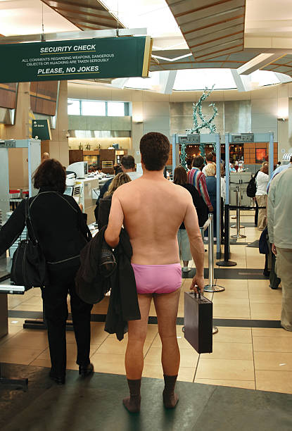 Airport Security Inspection Man standing in his underwear, waiting to go through an airport security check station customs agent stock pictures, royalty-free photos & images