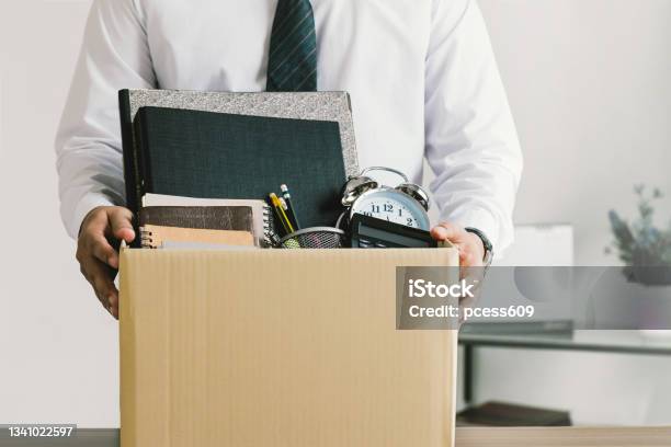 Resignation Businessmen Holding Boxes For Personal Belongings And Resignation Lettersquitting A Jobthe Big Quitthe Great Resignation Stock Photo - Download Image Now