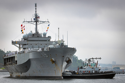 Yokosuka, Kanagawa Prefecture, Japan - June 24, 2020: The USS Blue Ridge (LCC-19) guided back to port by tugs through the harbor to its homeport.