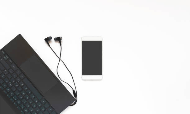 istock Laptop, headphones and phone on a white background. Minimum working space. Top view, flat layer. 1341036209