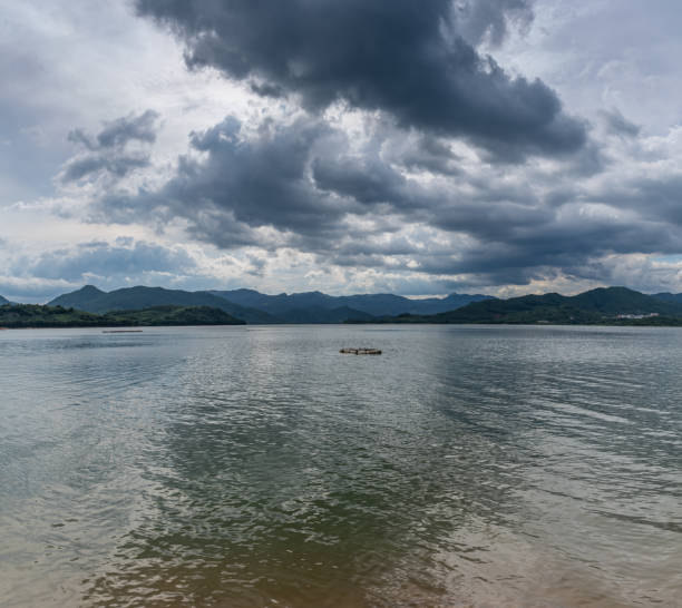 istock The sky is covered with clouds and there are waves on the water 1341038080