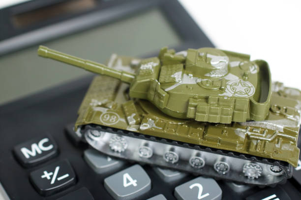 istock Military tank on calculator, War Cost concept 1341040055