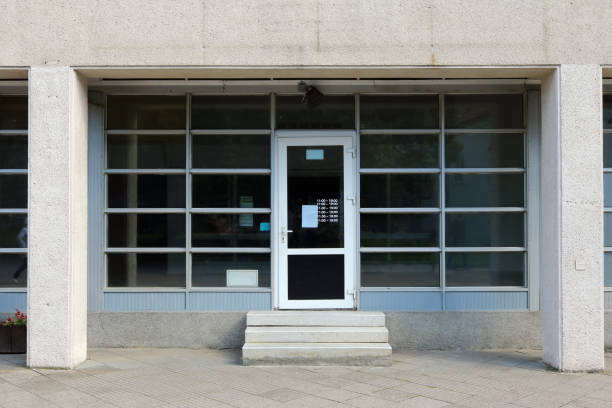 istock Glass windows and doors of a closed  modern   office building 1341041136