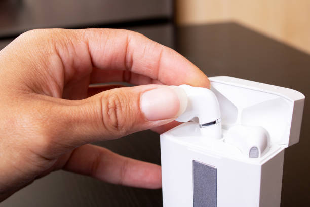 istock Hand takes out wireless earbuds close up 1341041292
