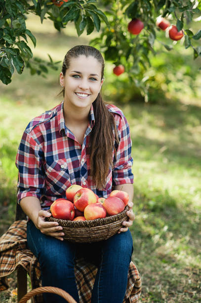 istock Girl with Apple in the Apple Orchard 1341043429