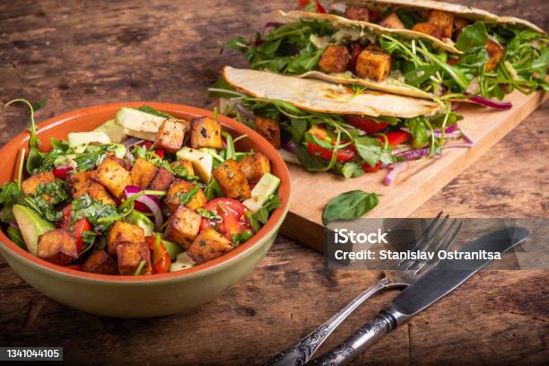 Vegan Salad Bowl With Vegetables And Fried Tofu Top View And Tacos With Vegetable Salad Vegetarian Cuisine Stock Photo - Download Image Now