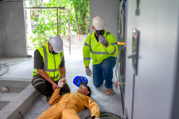 istock Electric worker suffered an electric shock accident unconscious. Safety team CPR for first aid Electric worker loses in electric shock accident at work on site. Accident in control room of factory. 1341045164