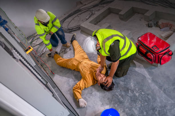 istock Electric worker suffered an electric shock accident unconscious. Safety team CPR for first aid Electric worker loses in electric shock accident at work on site. Accident in control room of factory. 1341045175