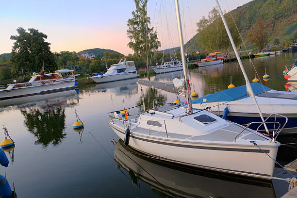 istock Motorboats and small yachts in a bay at dawn 134104591