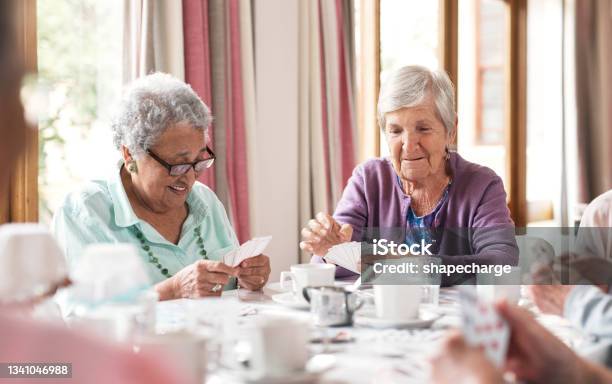 Shot Of A Group Of Senior Women Playing Cards Together At A Retirement Home Stock Photo - Download Image Now
