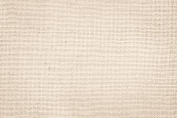 istock Jute hessian sackcloth canvas woven texture pattern background in light beige cream brown color blank empty 1341048829