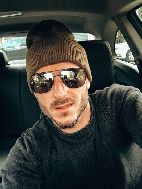 istock man take a selfie in the car 1341053166