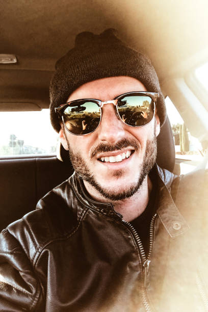 istock man take a selfie in the car 1341053179
