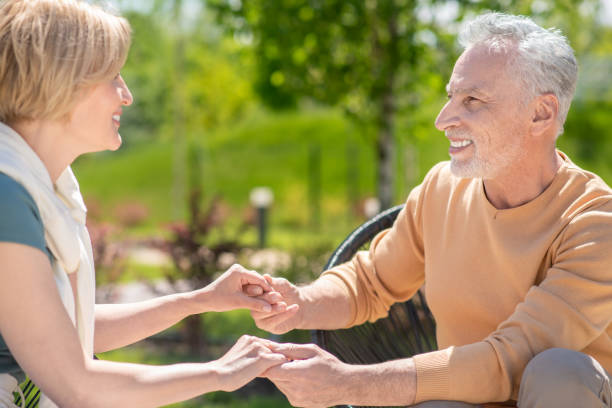 istock Two middle-aged people in love looking at each other 1341056059
