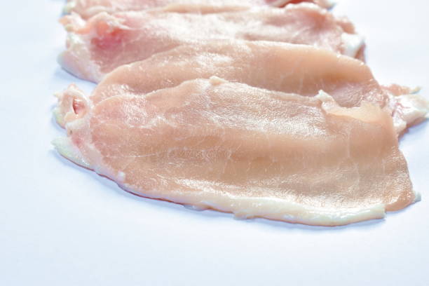istock raw pork tenderloin slice  ingredient food on white background 1341059342