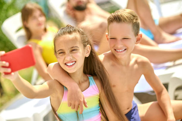 istock Kids and thier parent having good time on a beach 1341063577