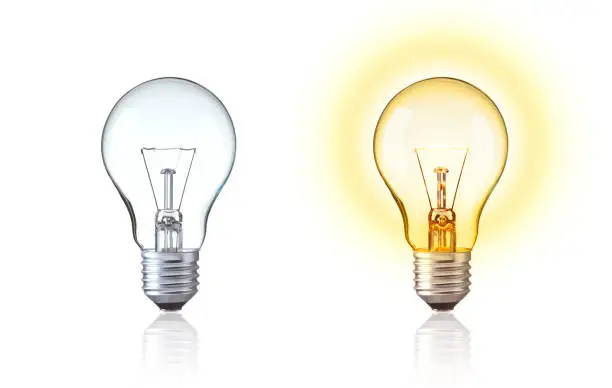 Photo of Classic light bulb isolate on white background. Turn on and turn off of Tungsten light bulb show big idea,  innovation, save energy, idea of Evolution, old style or retro light bulb Concept.