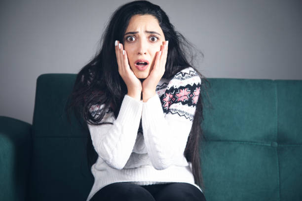 istock young scared and surprised woman 1341064593