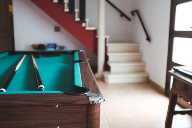 istock Biliiard table with stick poles on a game room 1341064959