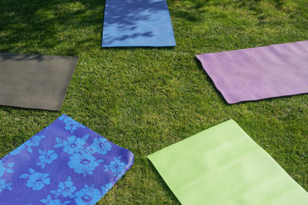 istock five yoga mats on the green with fresh grass 1341065271