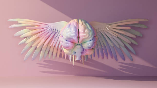 multicolored brain with wings front view in a beam of light stock photo