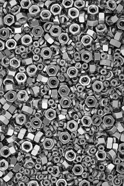 Nuts Background Close up view of nuts nut fastener stock pictures, royalty-free photos & images