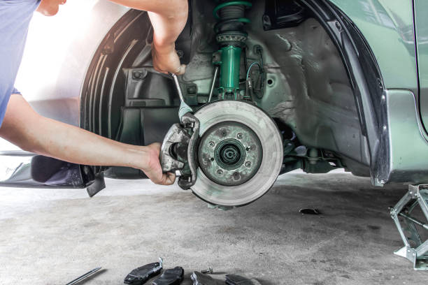 Hand a technician man repairing action and service disk brake for car,change Brake pads and system check in basic maintenance Hand a technician man repairing action and service disk brake for car,change Brake pads and system check in basic maintenance brake stock pictures, royalty-free photos & images