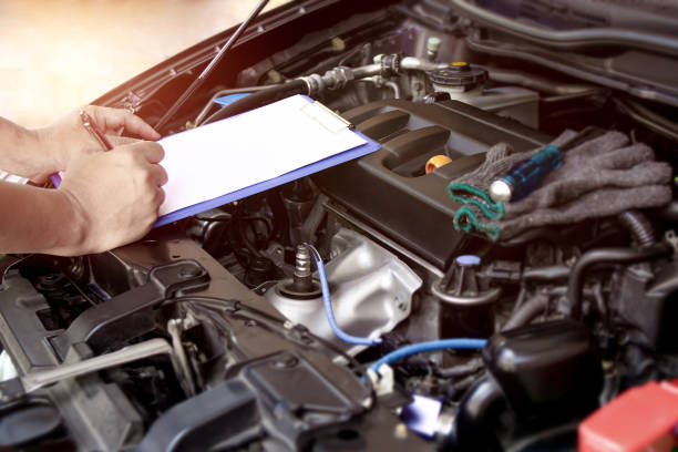 istock On site concept : Employees technician checking list on the paper note for maintenance and service of broken car 1341072150