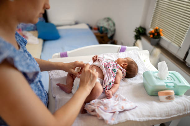 istock Mother changing the baby's diaper 1341072230