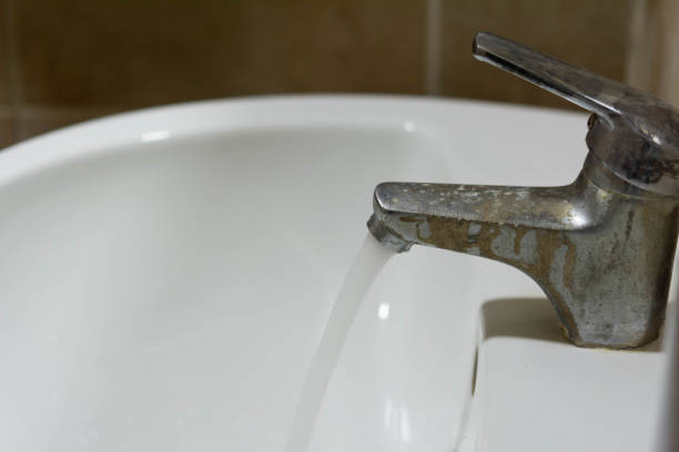 istock A close-up of a mixer with limescale, white chalk, stains and rust. 1341073640
