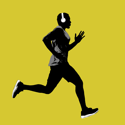 Profile side view silhouette of runner man isolated on yellow background. creative sport concept. studio shot.