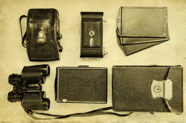 Vintage cameras with cases on a light background. Top view