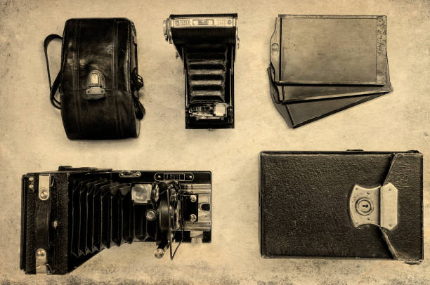 Vintage cameras with cases on a light background. Top view